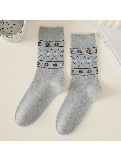 Light gray crew socks with blue hearts and snowflakes