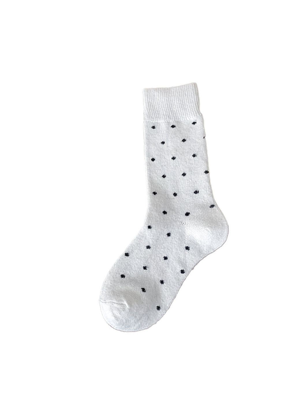 White crew sock with black polka dots on a white background