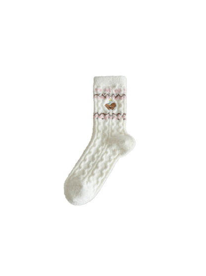 Ivory fuzzy-textured crew sock with zigzag bands and a bear motif