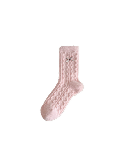 Light pink fuzzy-textured crew sock with a crossed-ribbon bow detail