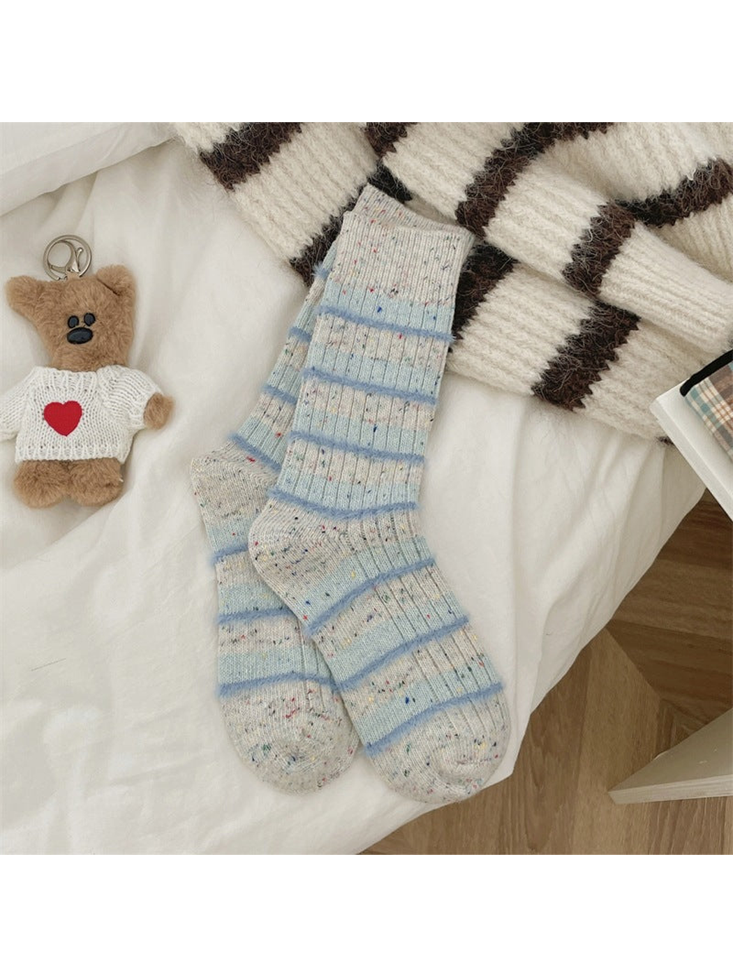 Ivory speckled crew socks with fuzzy light blue stripes, full pair view