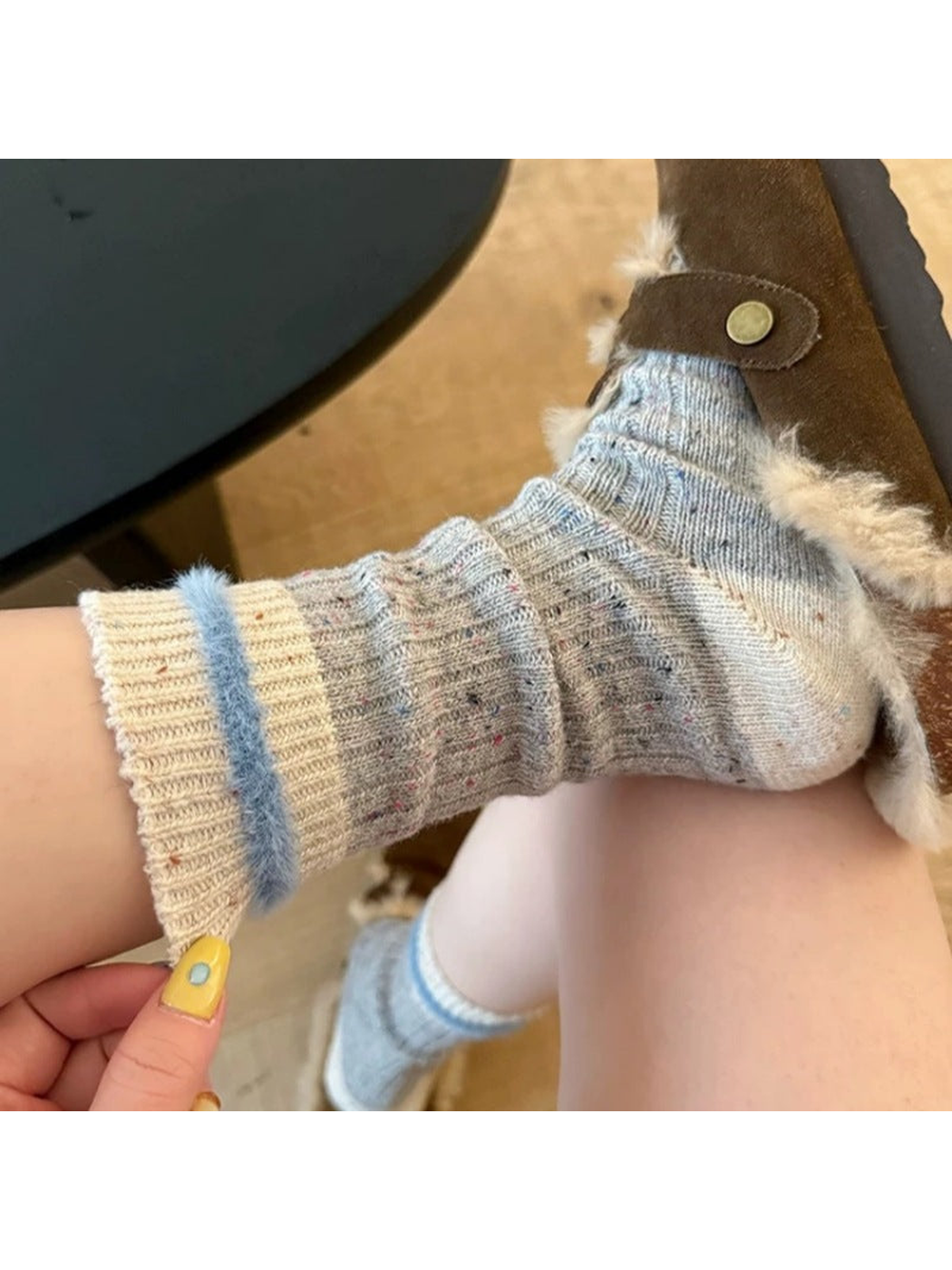 Close-up of the gray ribbed sock and fuzzy light blue cuff band