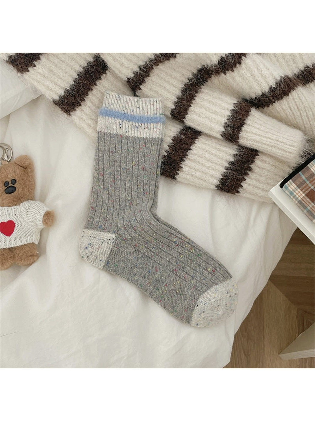 Gray ribbed speckled crew socks with ivory toe, heel and cuff