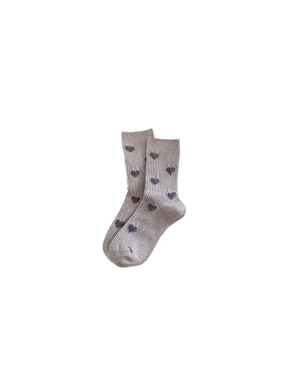 Greige ribbed crew socks with fuzzy dark heart motifs