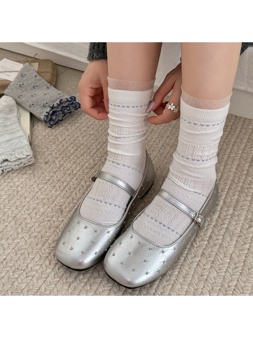 White pointelle crew socks worn with silver flats