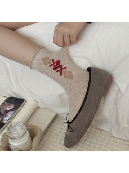 Beige argyle bow crew sock styled with a taupe ballet flat