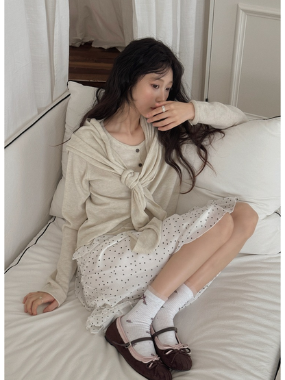 White floral crew socks styled with brown Mary Jane flats