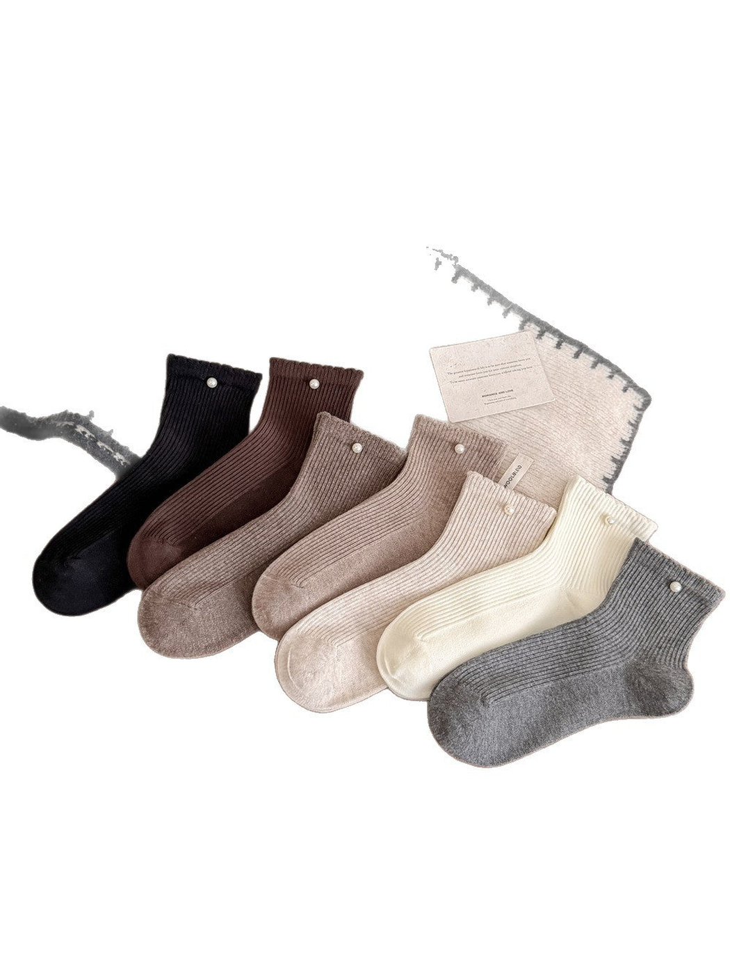 Seven colors of ribbed crew socks with pearl-like cuff accents