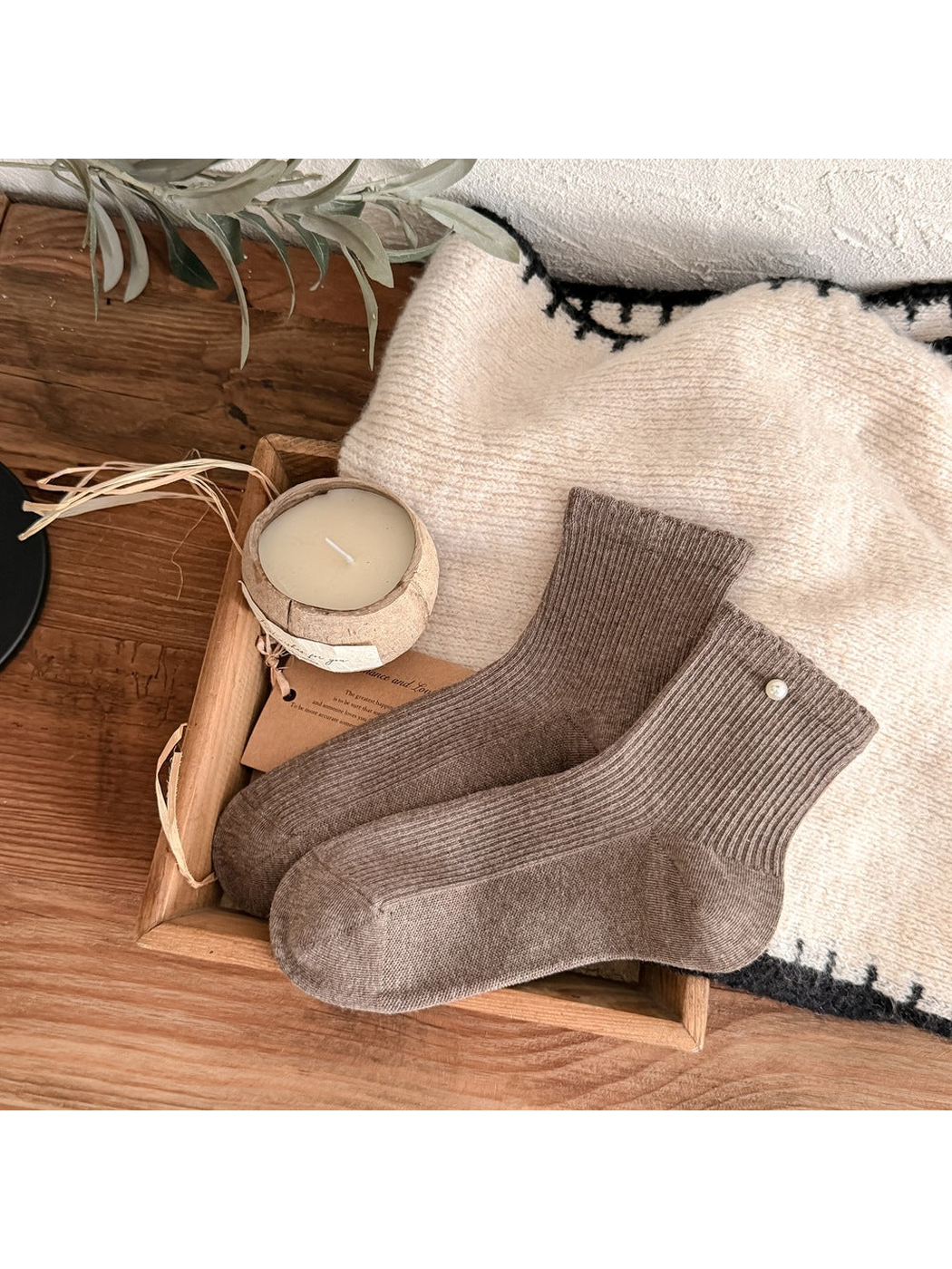Medium coffee brown ribbed crew socks with a pearl-like cuff accent