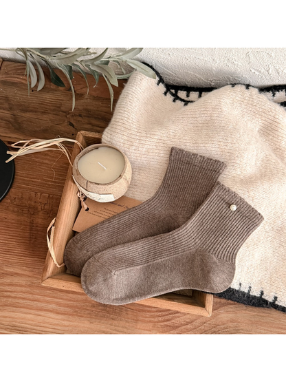 Medium coffee brown ribbed crew socks with a pearl-like cuff accent