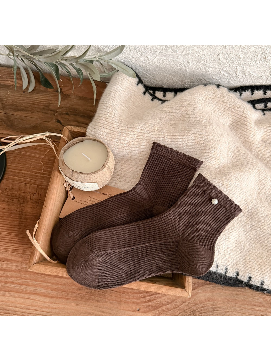 Dark coffee brown ribbed crew socks with a pearl-like cuff accent