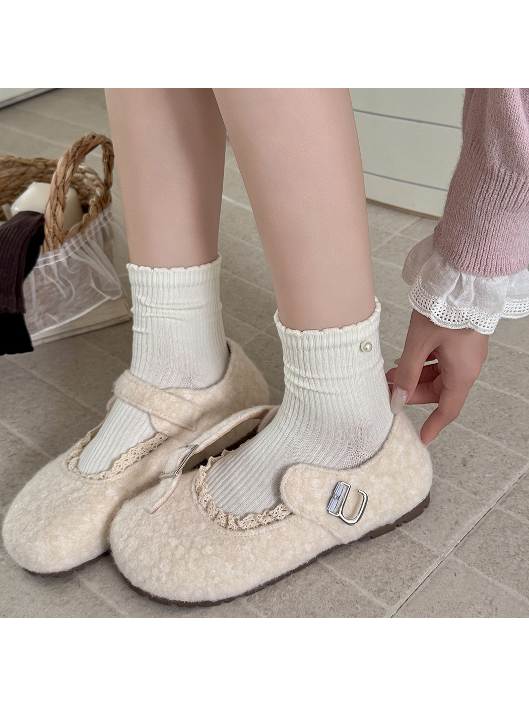 Ivory ribbed crew socks worn with cream Mary Jane shoes