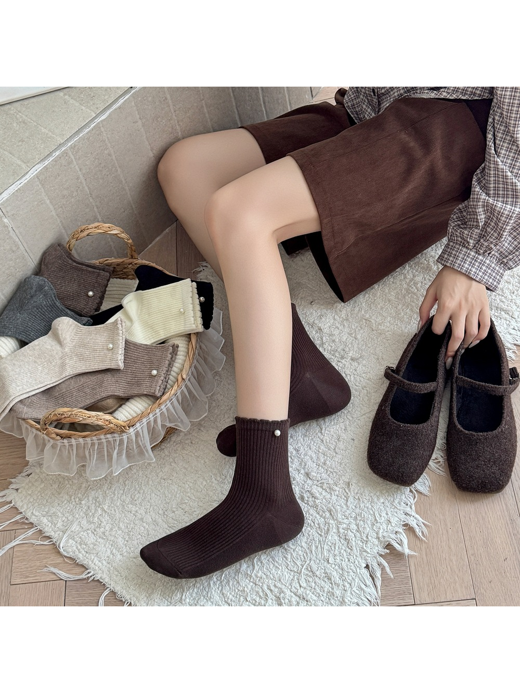 Dark brown ribbed crew socks worn beside matching Mary Jane shoes
