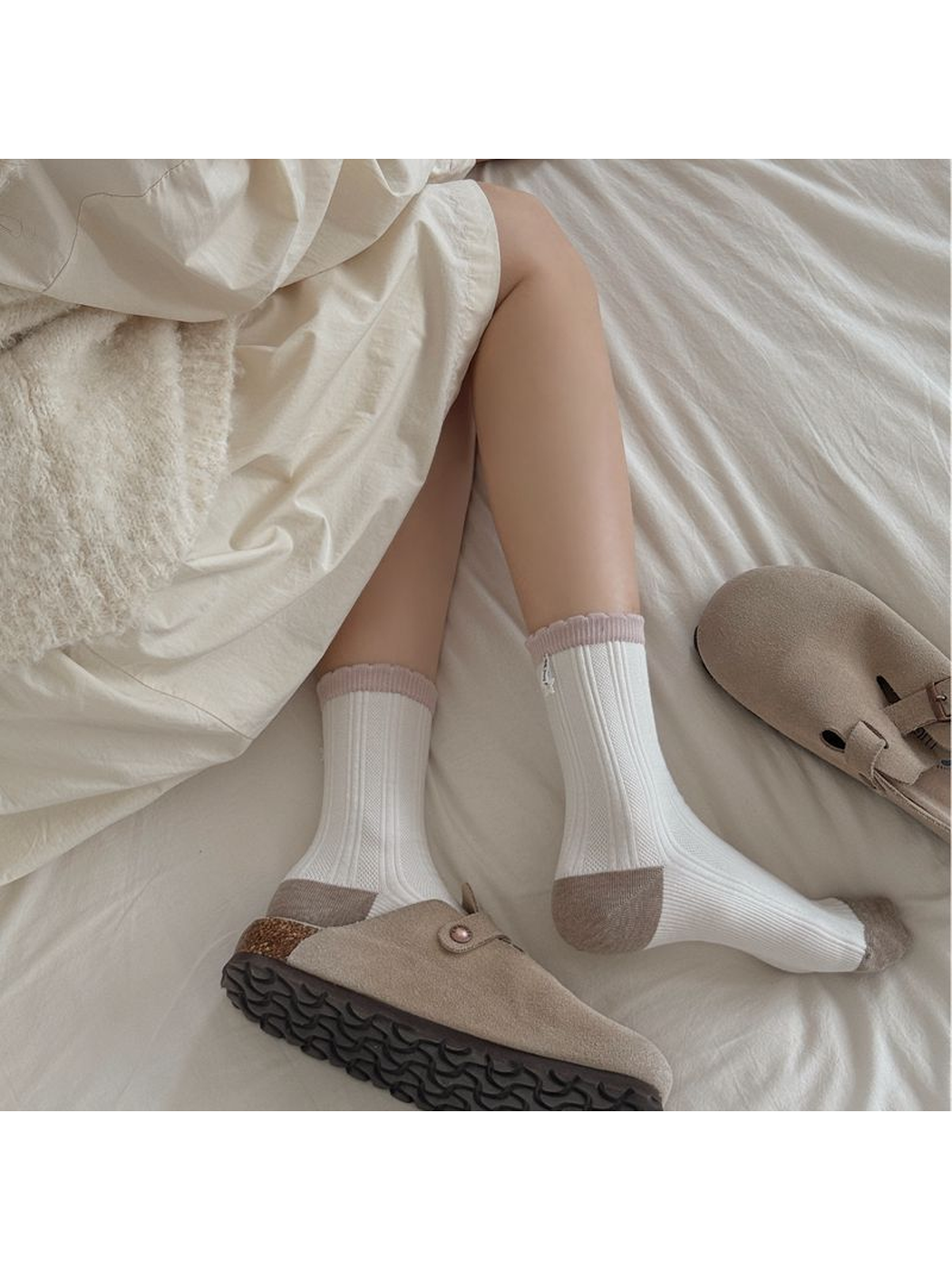 Ivory ribbed socks with contrasting toes, heels and pink cuffs styled with taupe clogs