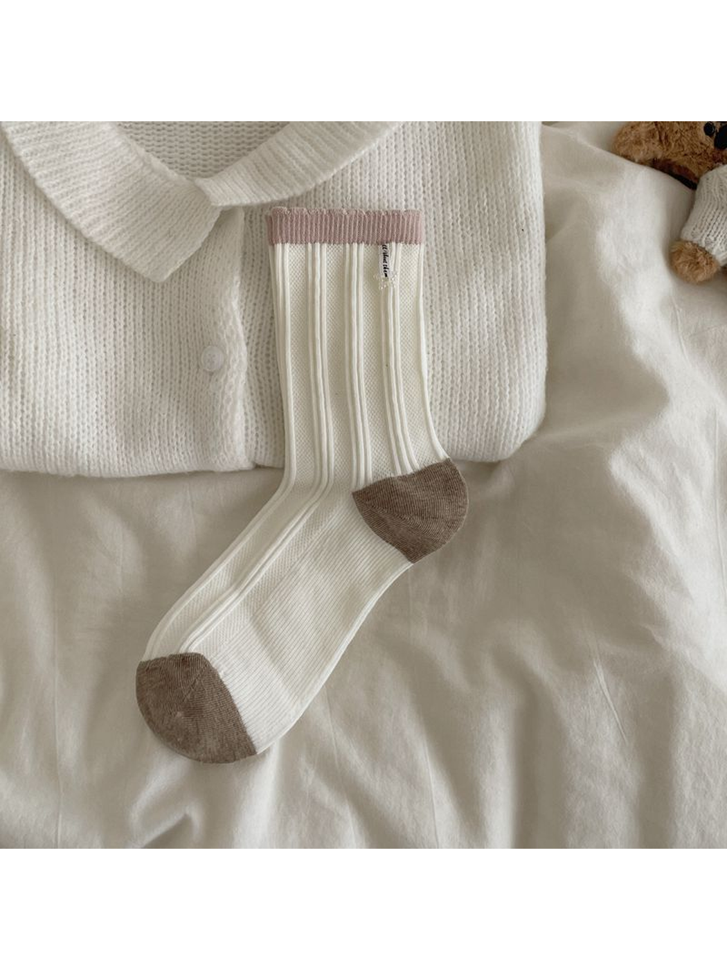Ivory ribbed crew sock with light coffee toe and heel and pink cuff