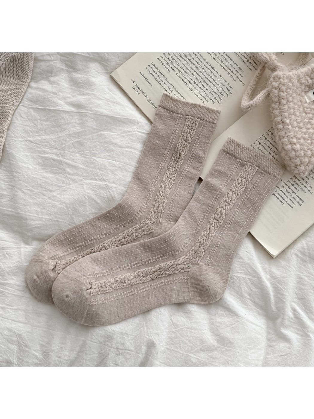 Beige crew socks with raised vertical cable panels