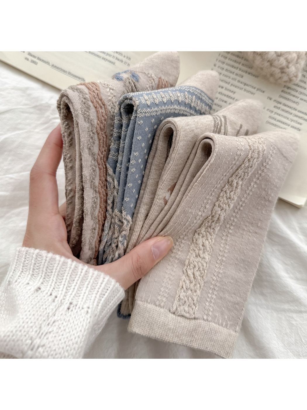 Close-up of folded crew socks showing raised and flat pattern textures