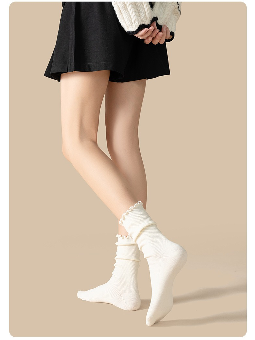Cream ribbed crew socks styled at two different cuff heights