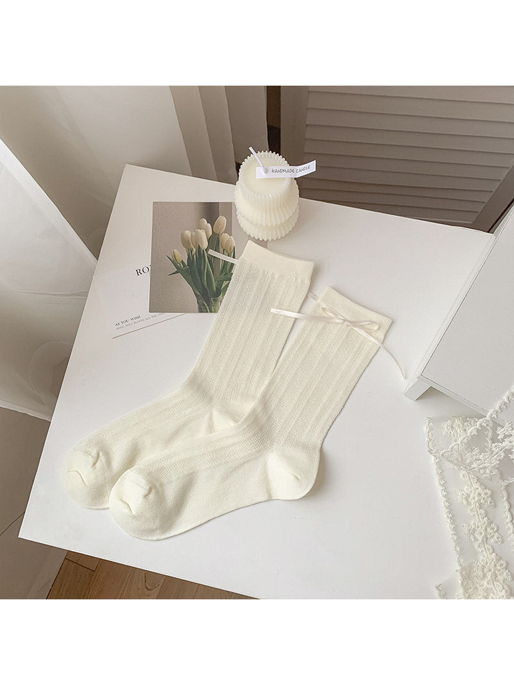 Ivory vertical-stripe crew socks with a ribbon bow