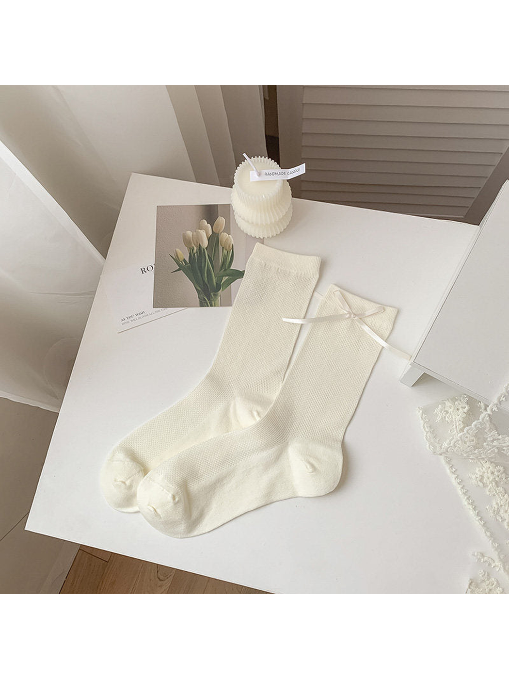 Ivory mesh crew socks with a ribbon bow