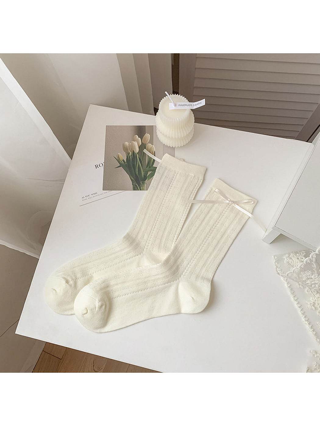 Ivory butterfly-pattern crew socks with a ribbon bow