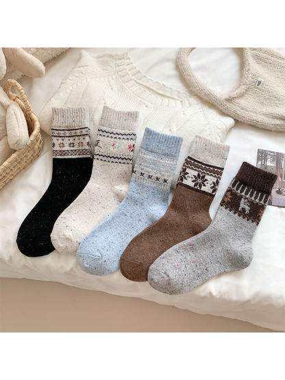 Five patterned crew sock styles displayed together