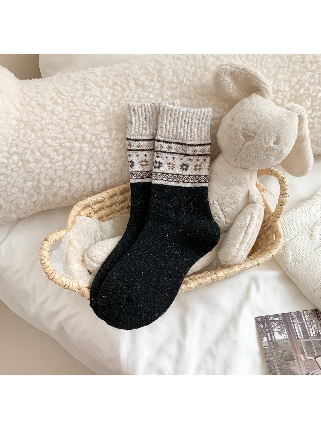 Black crew socks with contrasting snowflake and geometric bands