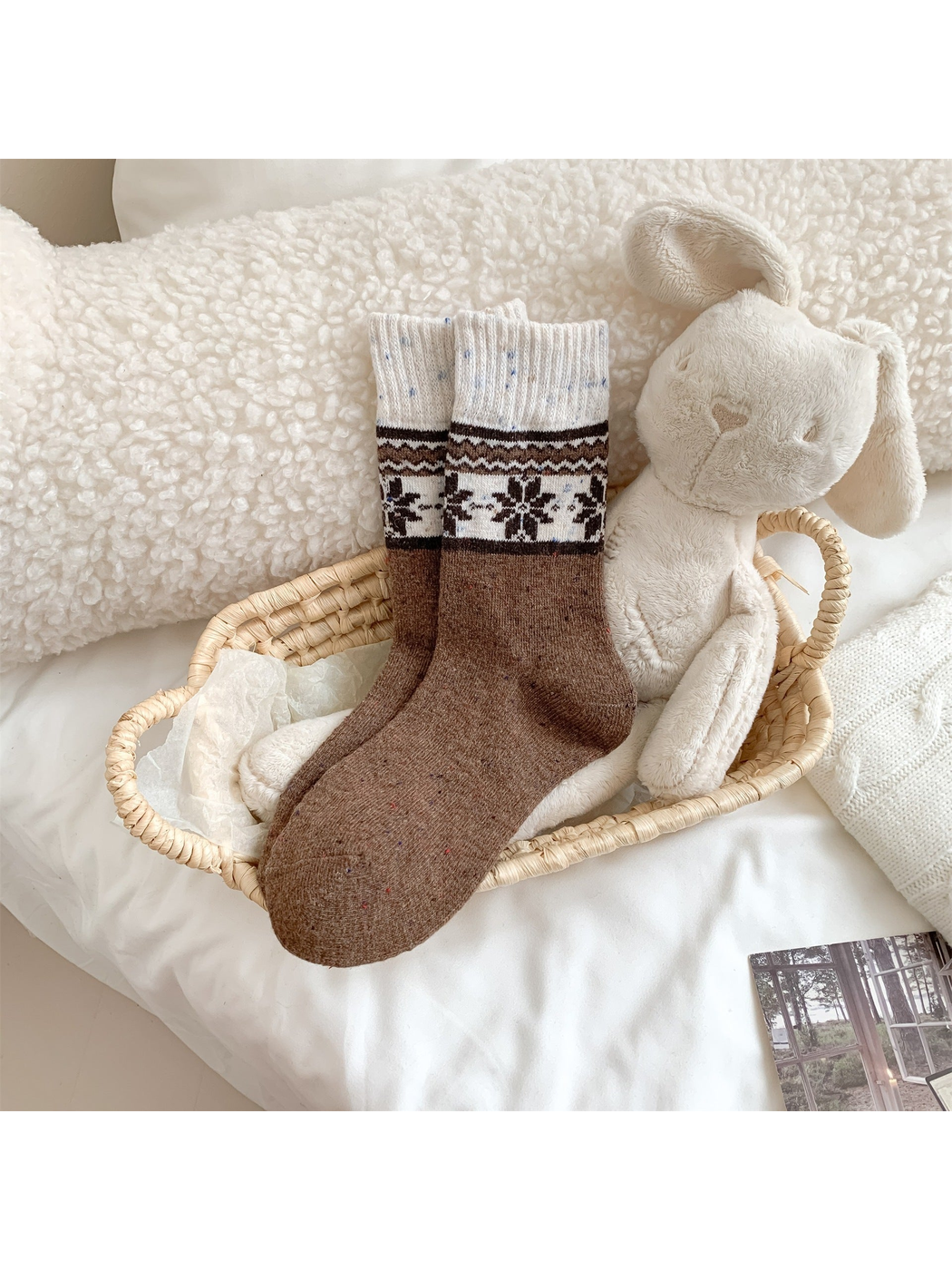 Brown crew socks with snowflake and reindeer pattern bands