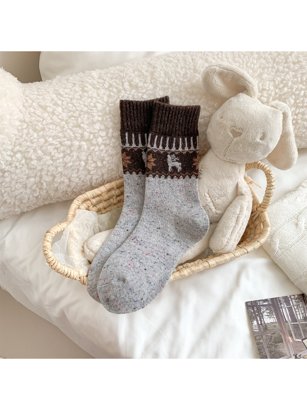 Gray crew socks with contrasting deer and tree pattern bands