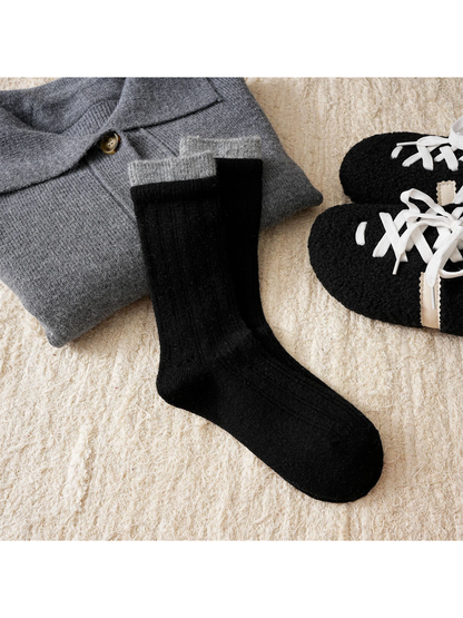 Black ribbed crew socks with a contrasting gray cuff