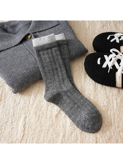Dark gray ribbed crew socks with a light gray cuff