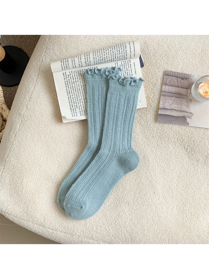 Light blue ribbed crew socks with ruffled cuffs