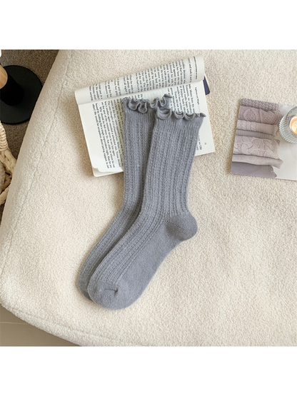 Dark gray ribbed crew socks with ruffled cuffs