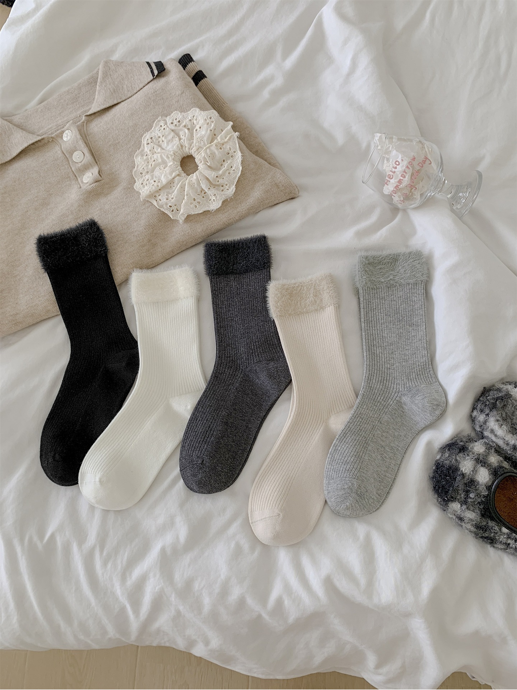Five ribbed crew sock colors with contrasting fuzzy cuffs displayed together