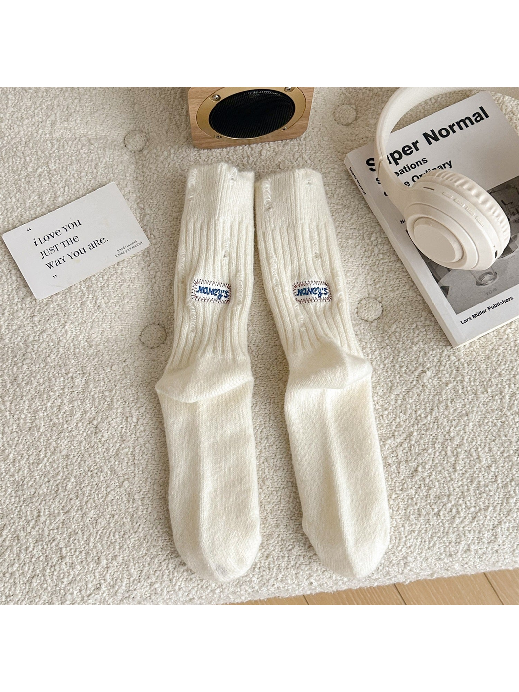 Ivory ribbed crew socks with distressed openings and sewn label patches