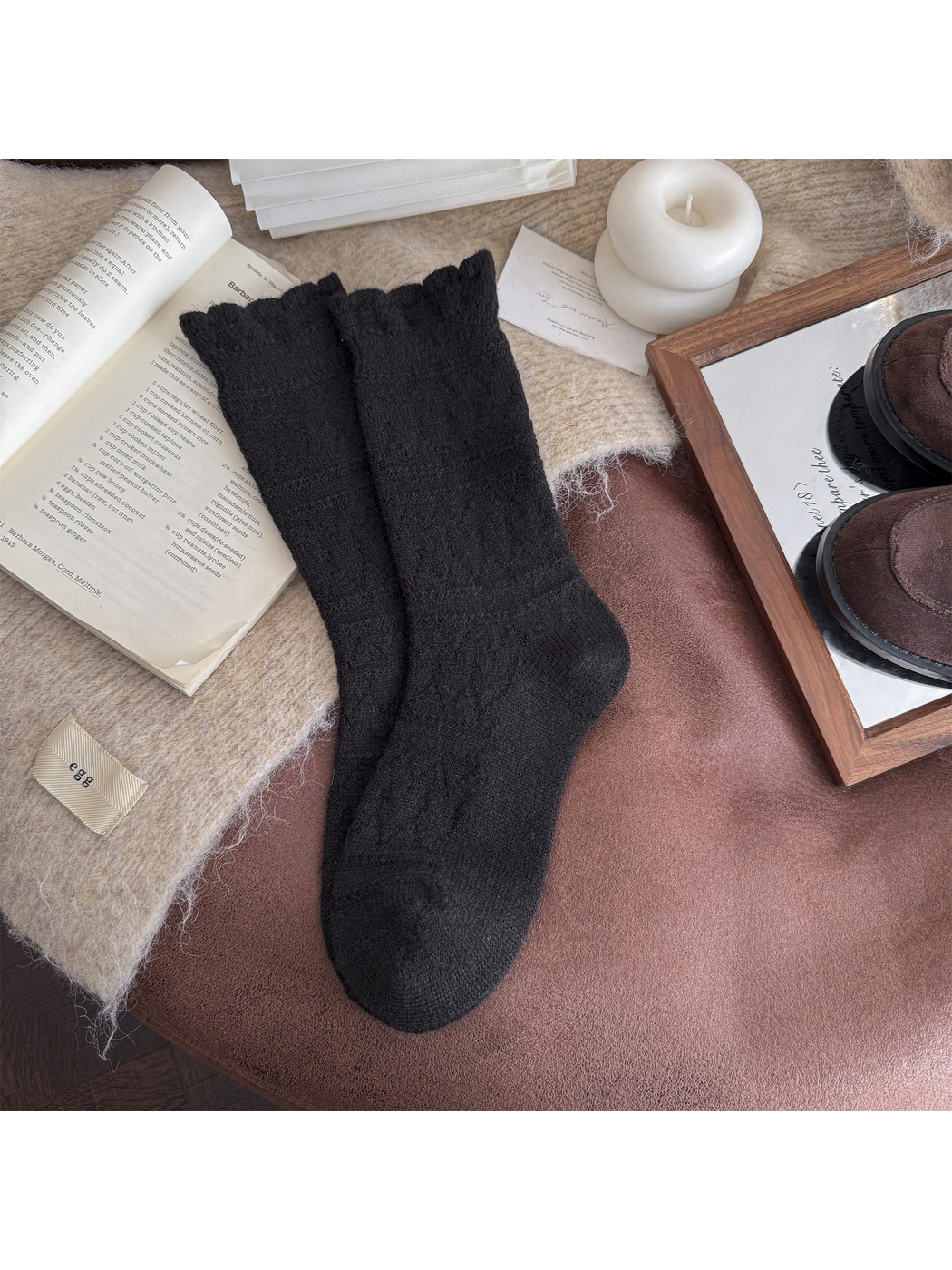 Black patterned crew socks laid flat