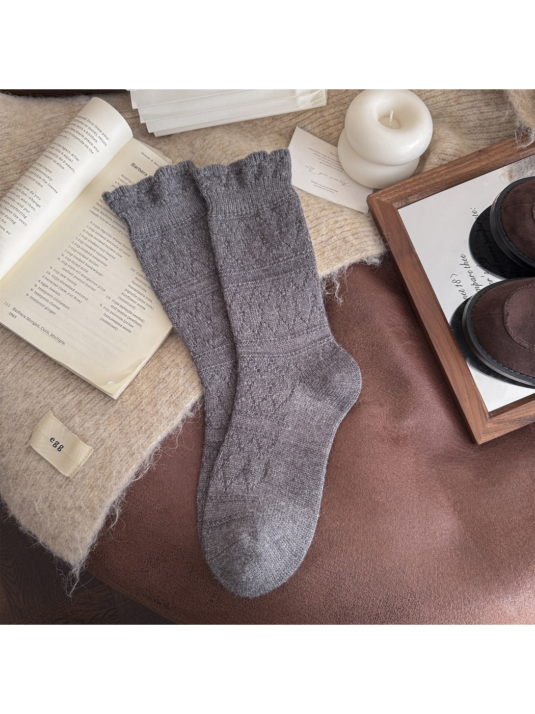 Dark gray patterned crew socks laid flat