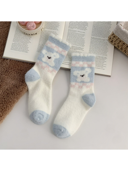 Cream fuzzy crew socks with blue dog motif and blue toes