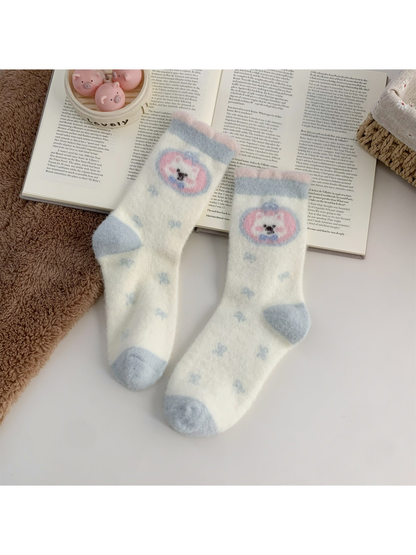 Cream fuzzy crew socks with round pink and blue dog motif