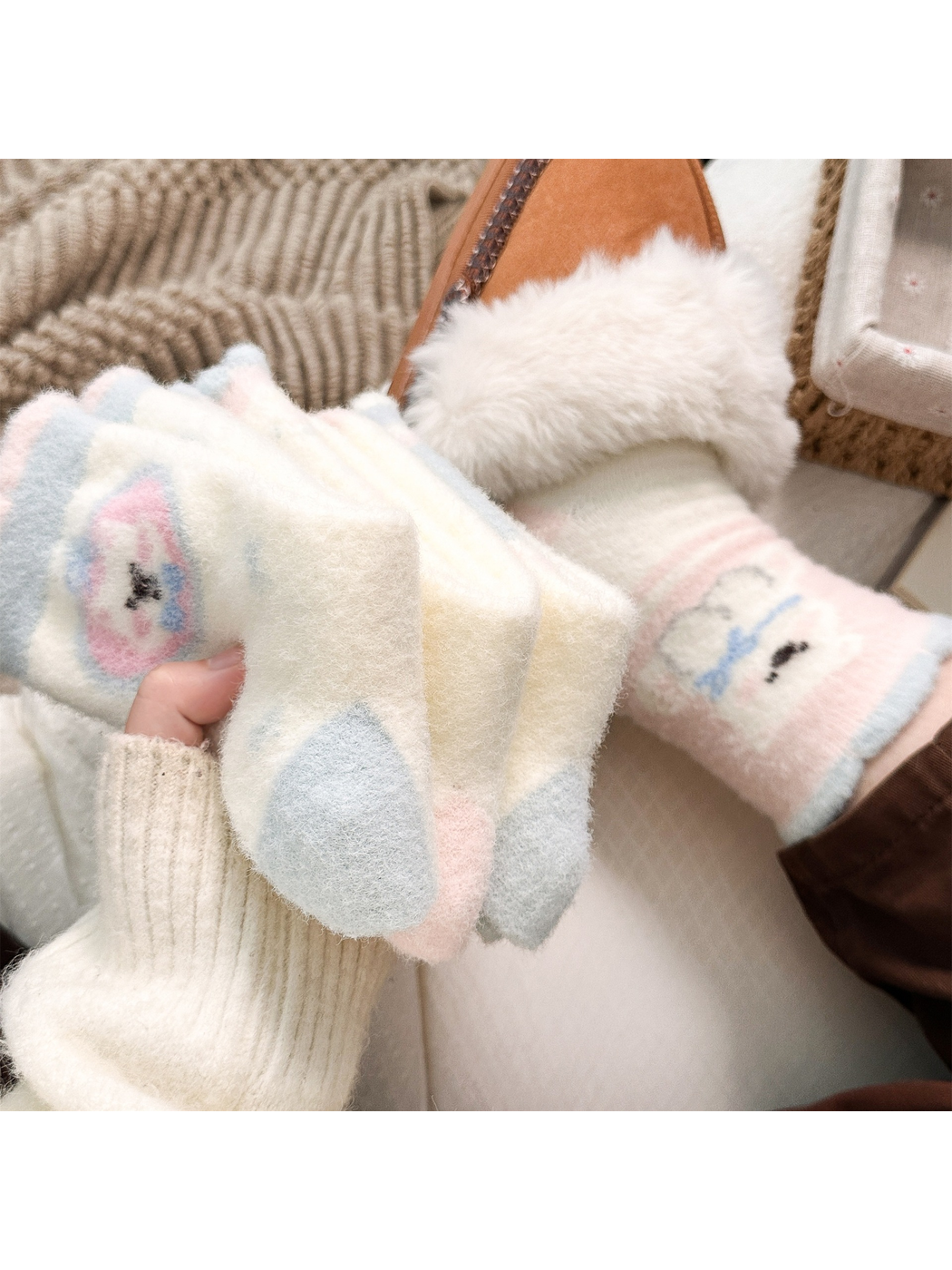 Close view of pastel fuzzy sock toes and heels beside a worn pair