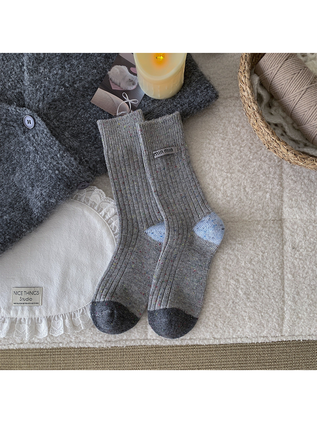 Gray speckled crew socks with light blue heels and dark gray toes