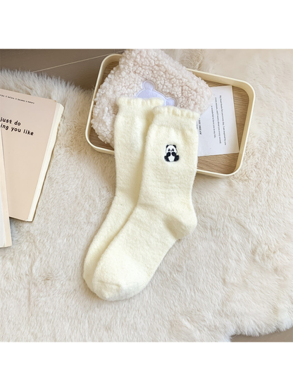 Ivory fuzzy crew socks with a small embroidered seated panda motif
