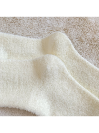 Close-up of the fine fuzzy texture across the ivory socks