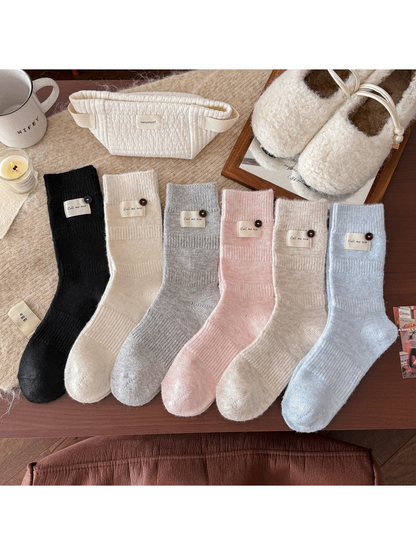 Six colors of ribbed crew socks displayed together