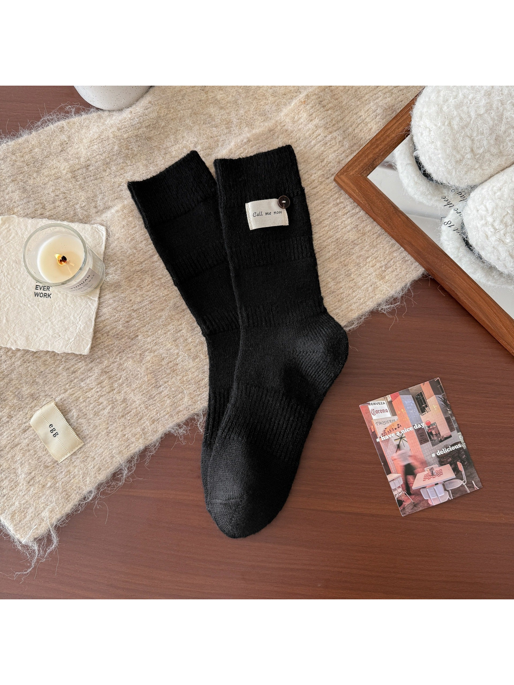 Black ribbed crew socks with fabric label and button detail