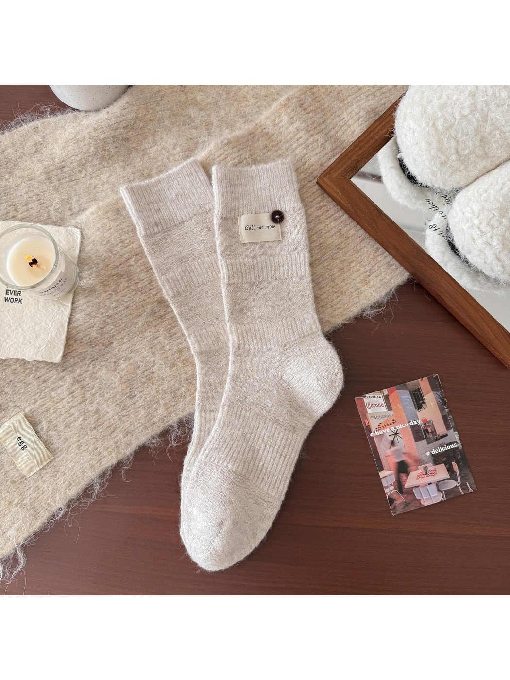 Beige ribbed crew socks with fabric label and button detail