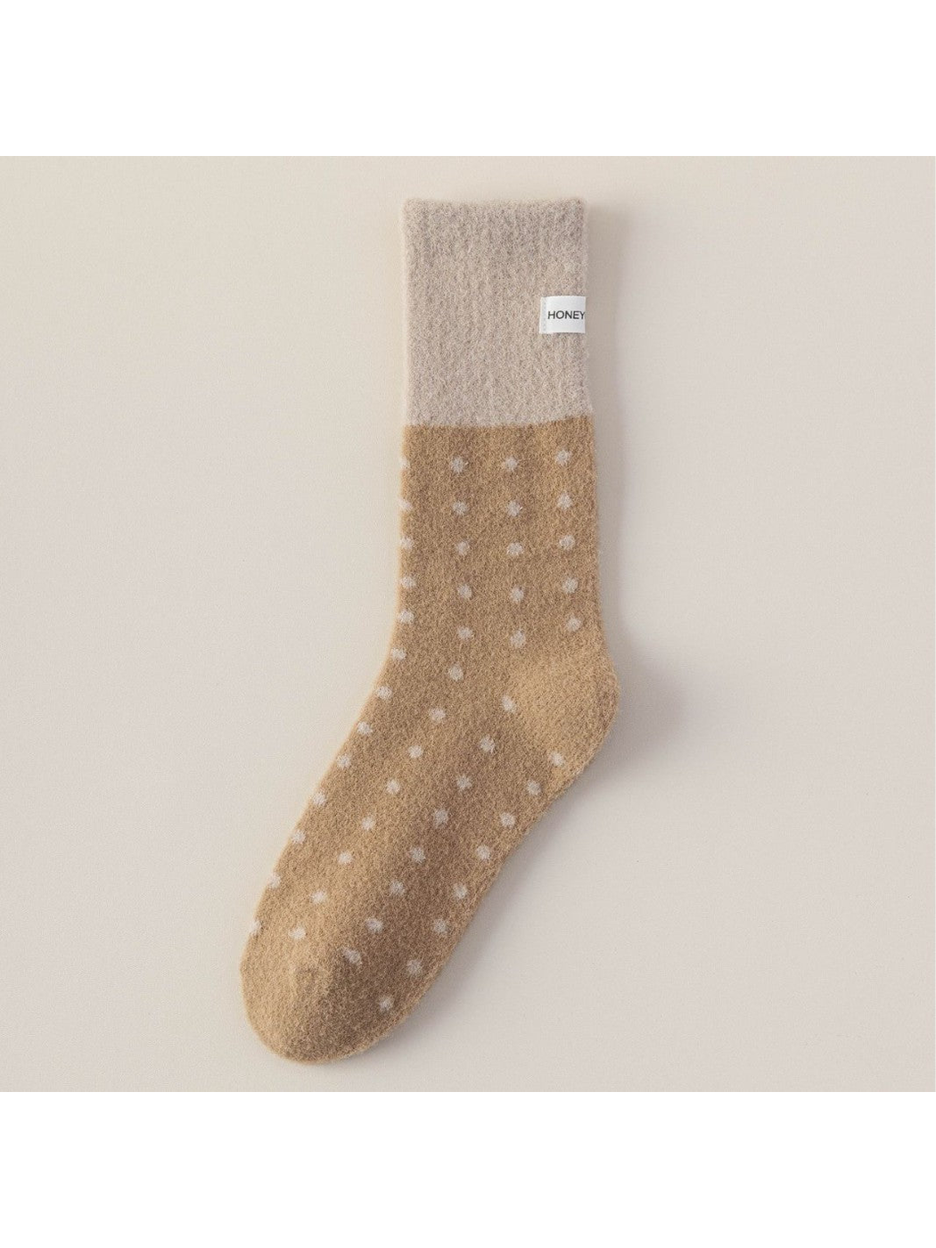 Camel fuzzy crew sock with greige cuff and white polka dots
