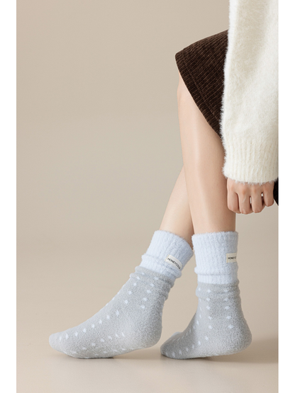 Gray fuzzy polka-dot crew socks worn with the cuffs softly gathered