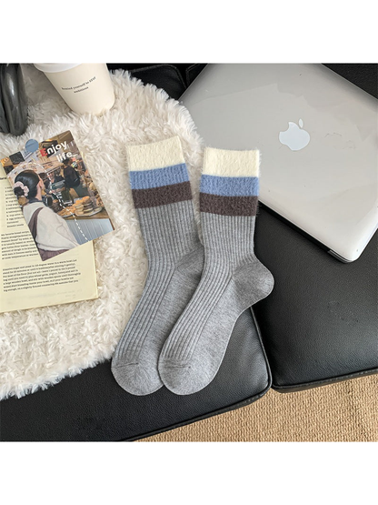 Light gray ribbed crew socks with blue and brown striped cuffs