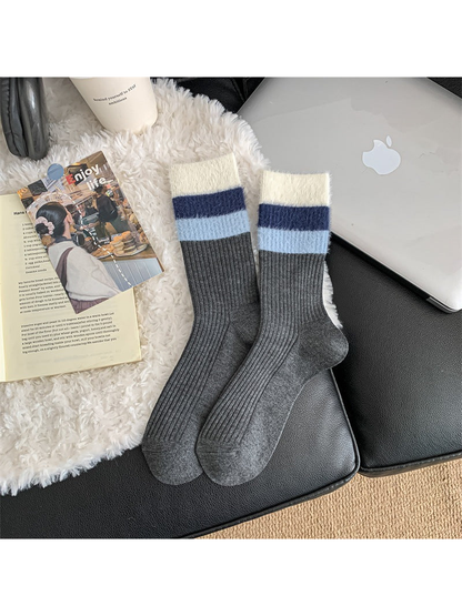 Dark gray ribbed crew socks with navy and light blue striped cuffs